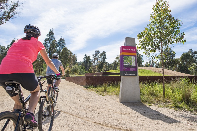 Wylde entrance with two bike riders