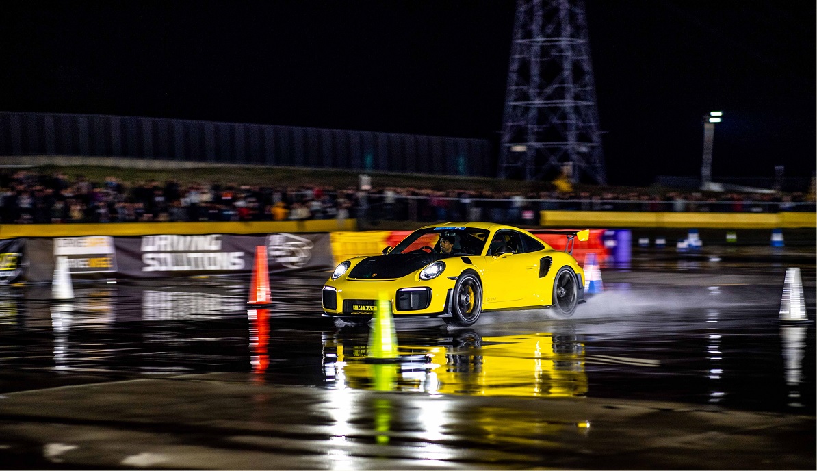 black and yellow racing car on the track